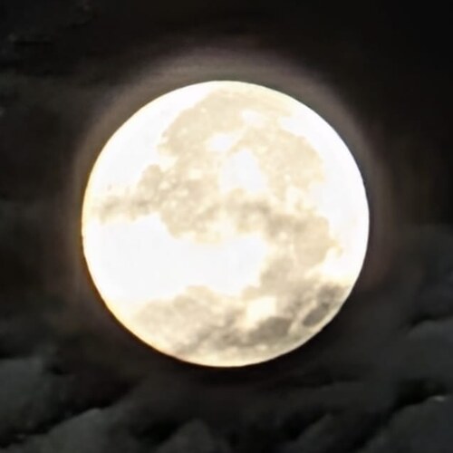Full moon over clouds
